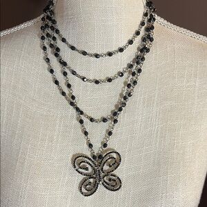 Four strand Black bead butterfly pendant choker.  Boho  Gothic. 3018.